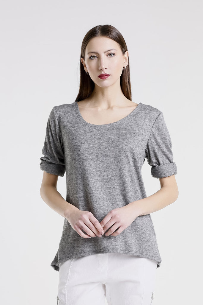 Woman wearing a gray top on a white background