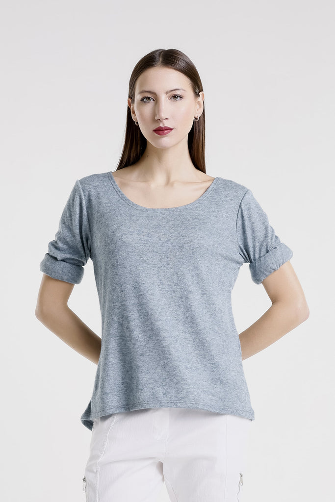 Woman wearing a gray t-shirt against a white background