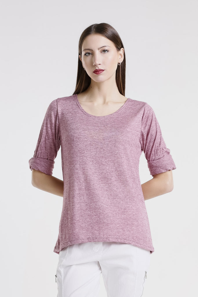 Woman wearing a pink sweater on a white background