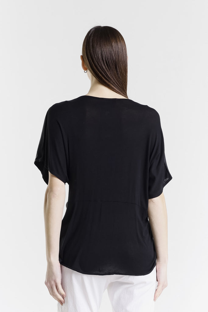 Woman wearing a black t-shirt on a white background