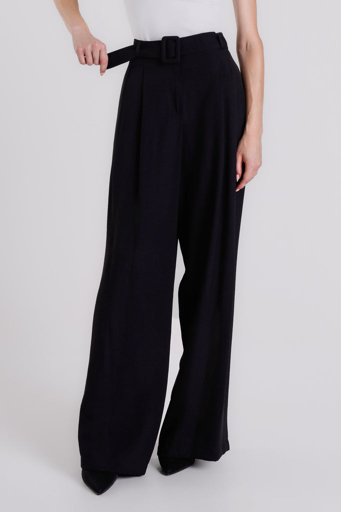 Black wide-leg pants with a belt worn by a person on a white background